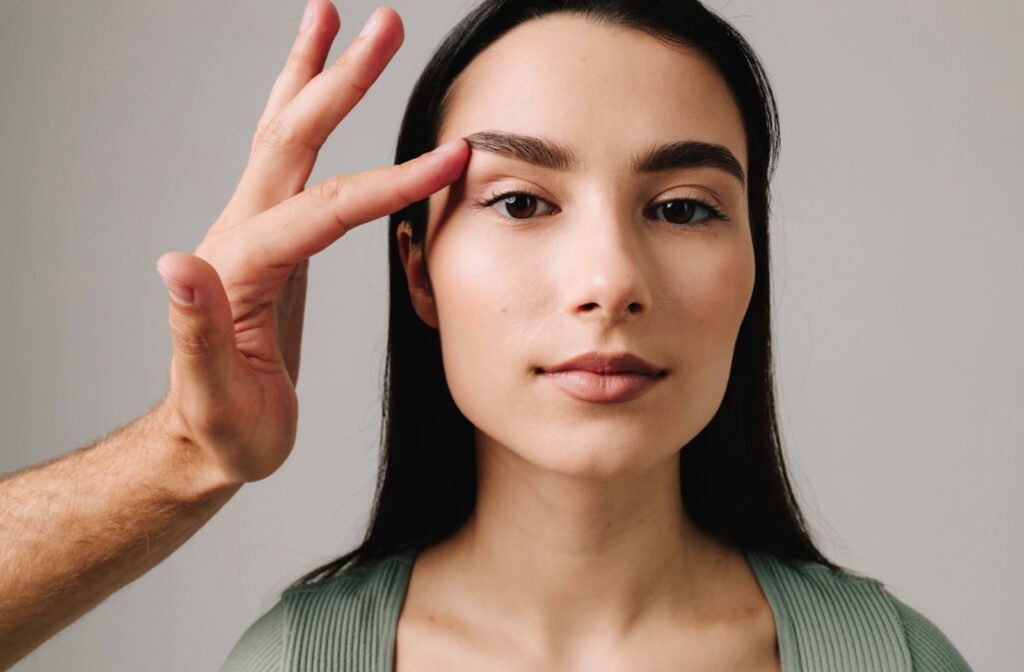 A person having their eyelid examined